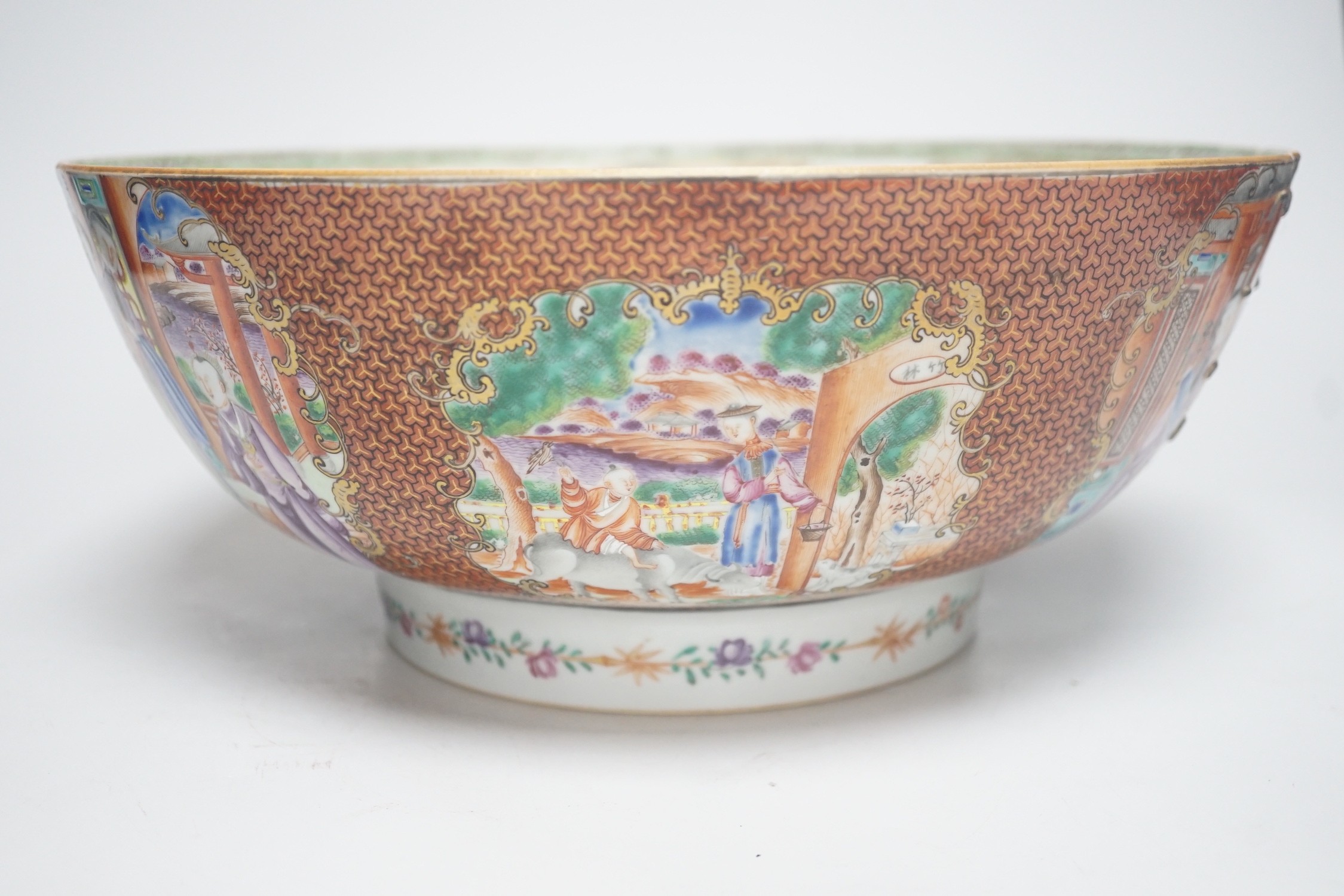 An 18th century Chinese export famille rose ‘mandarin’ punch bowl, 31cm diameter (af)